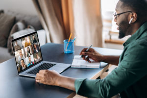 Online business briefing. Male African American employee speak on video call with diverse multiracial colleagues, on laptop screen diverse business people, meeting online, group brainstorm