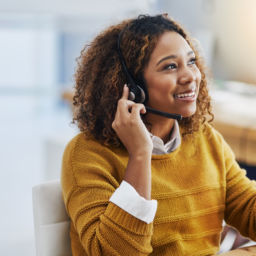 Her display of care in customers is great business. Shot of a female agent working in a call centre.