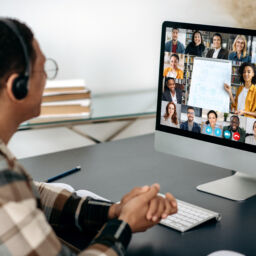 Online education, webinar, lecture. Male student studying online, on computer screen are multiracial people, female teacher conducts online lesson for students by video call, virtual learning concept.