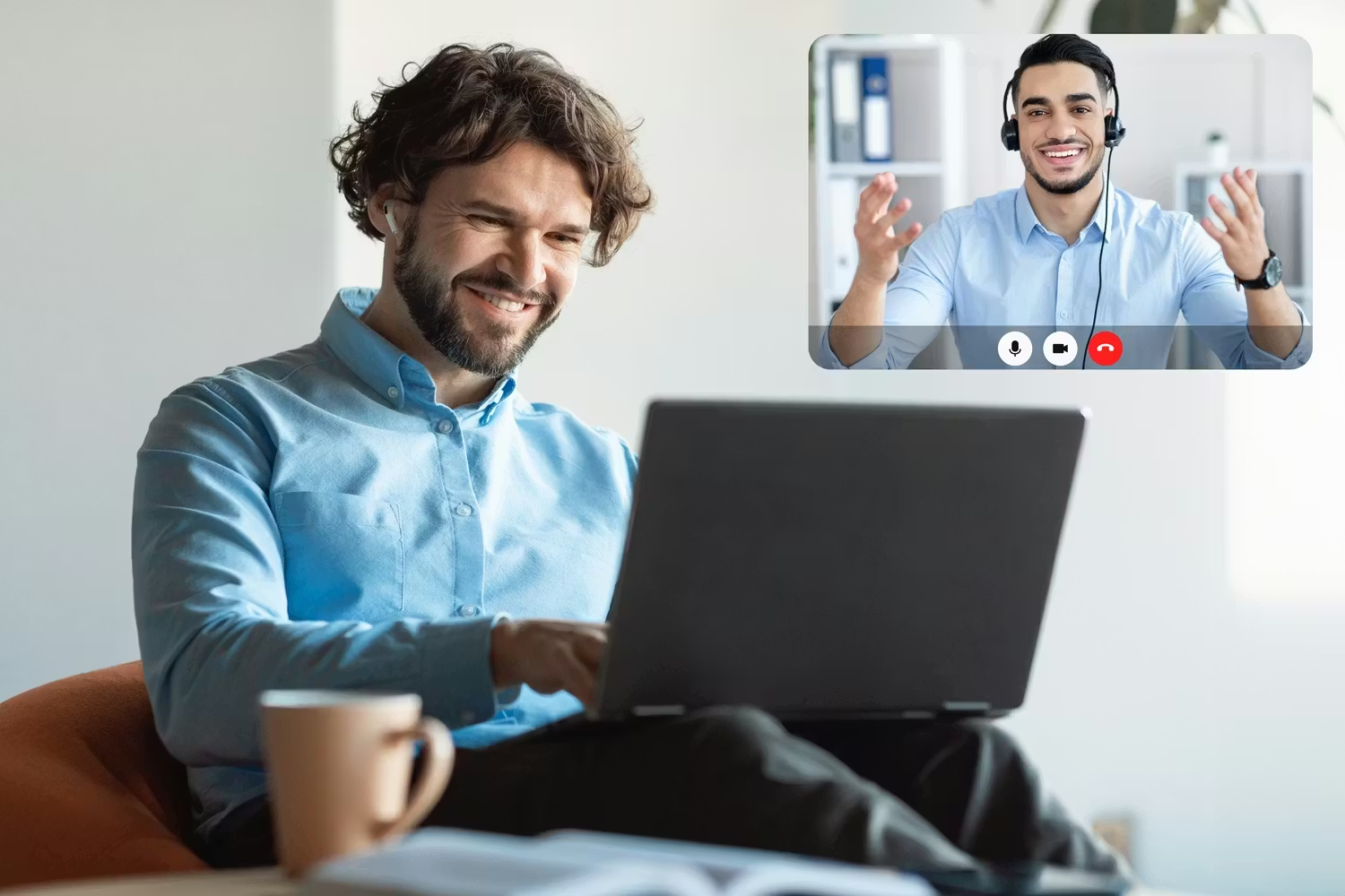 Smiling professional man attending a one-on-one online language lesson from home on his laptop, with his language instructor visible on screen via video call